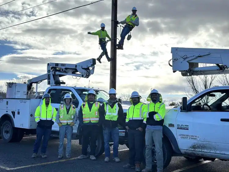White bucket truck with large aerial lift arm