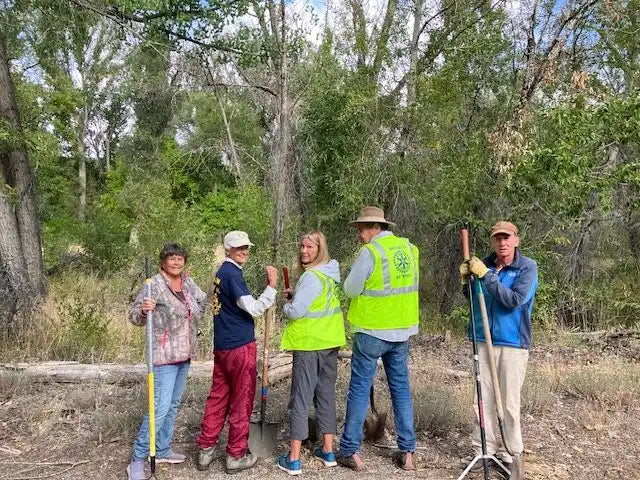 Yellow reflective safety vest with black text and logo.